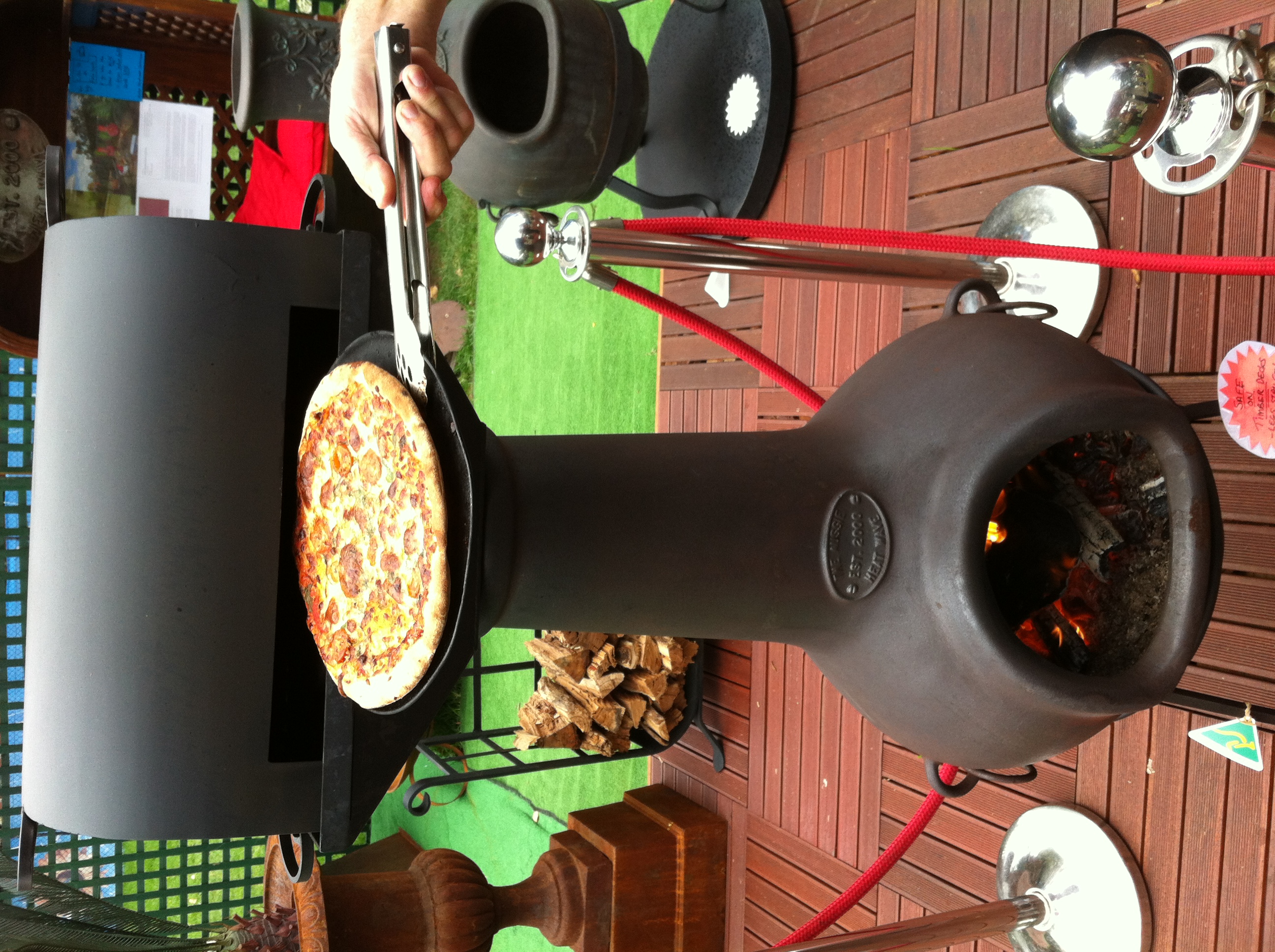 Cooking a pizza on a chiminea